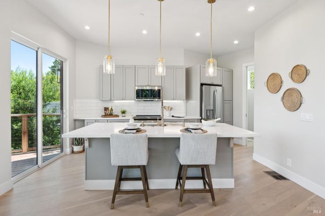 a kitchen with a stove and cabinets