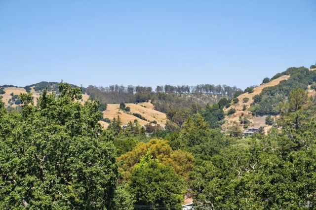 a view of a balcony with wooden floor