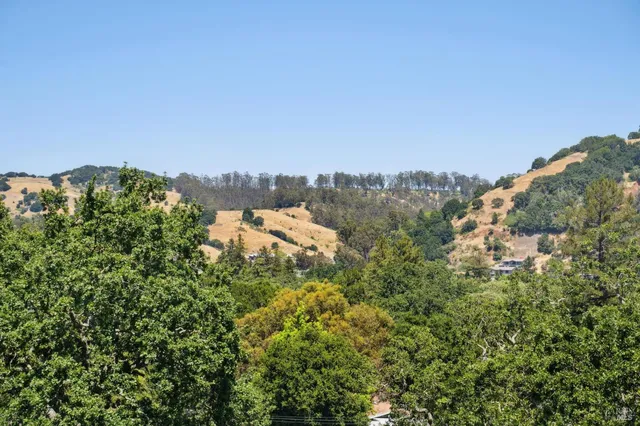 a view of a balcony with wooden floor