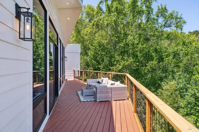 a bedroom with a bed and glass door