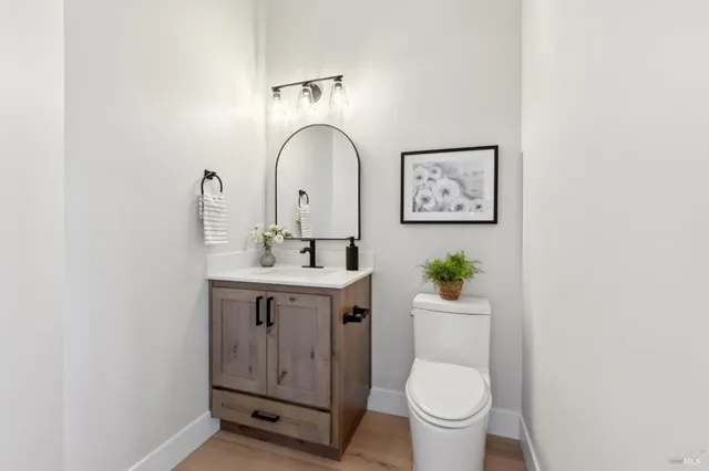 a bathroom with a double vanity sink window and a mirror
