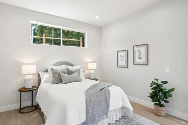 a bathroom with a double vanity sink mirror and shower