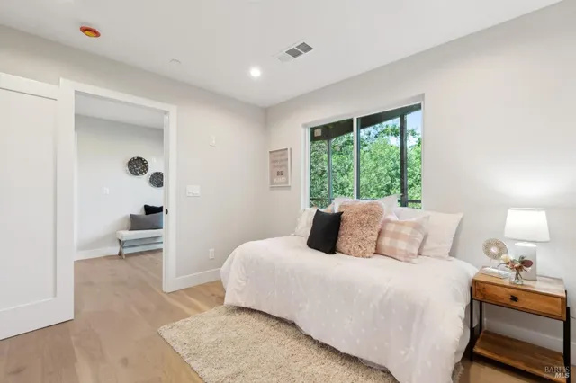 a bathroom with a granite countertop sink mirror vanity shower and a toilet