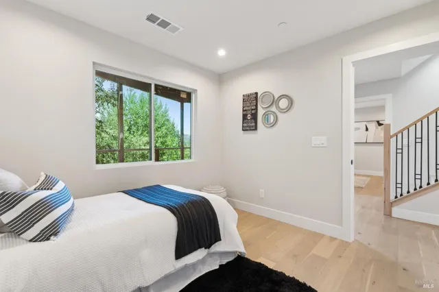 a balcony with view of outdoor space