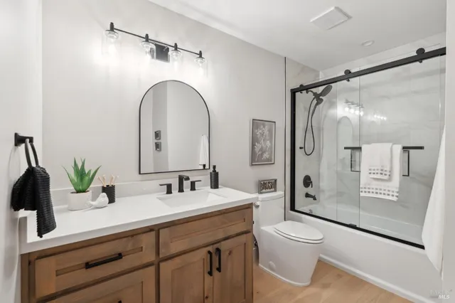 a view of an empty room with windows