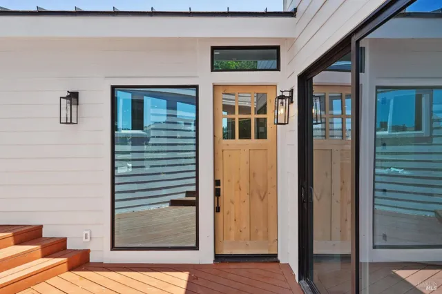 a view of balcony with wooden floor