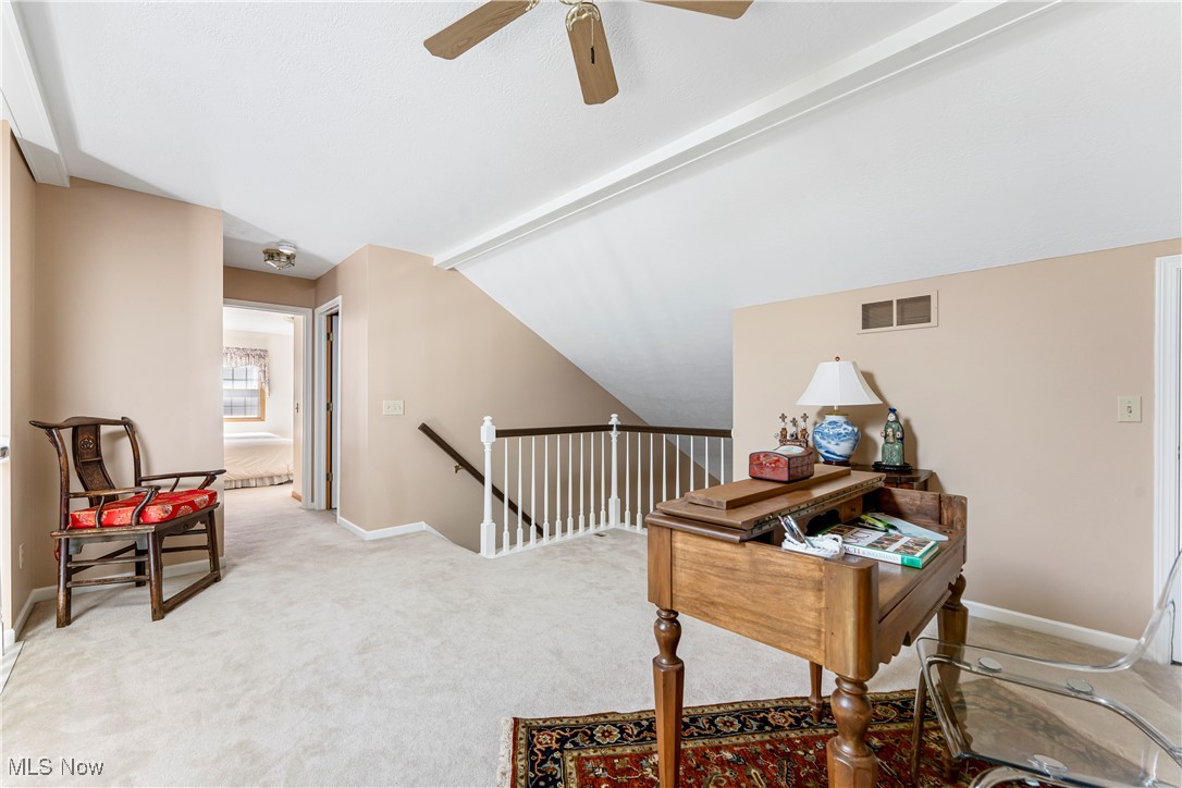 2444 Charing Cross Road Northwest Canton, OH 44708 - Photo 24 of 40 Hallway with light carpet and vaulted ceiling with beams