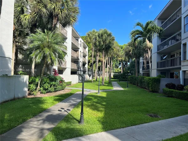 a view of a palm trees in front of a house