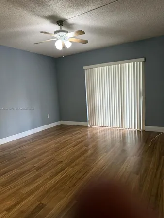 a bedroom with a bed and a balcony