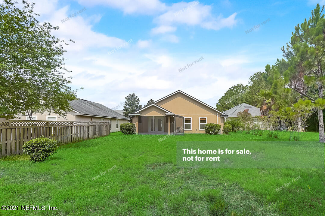608 Birchbark Trail St. Augustine, FL 32092 - Photo 12 of 35 a view of a big yard with a house in the background