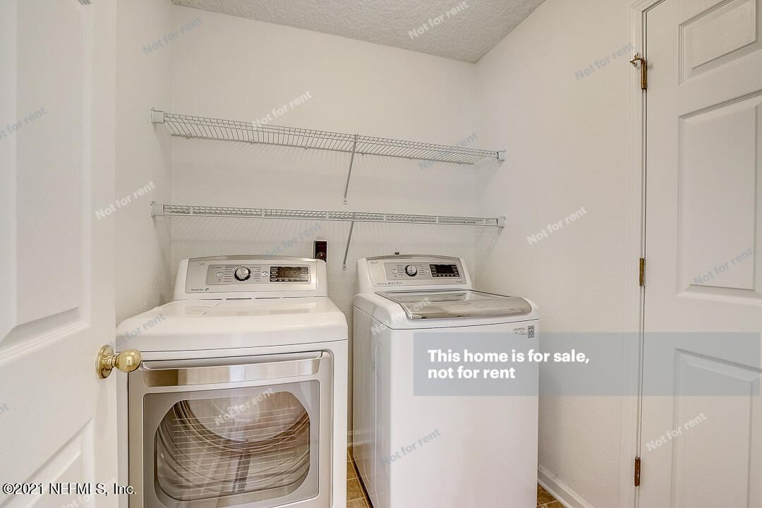 608 Birchbark Trail St. Augustine, FL 32092 - Photo 16 of 35 a utility room with dryer and washer