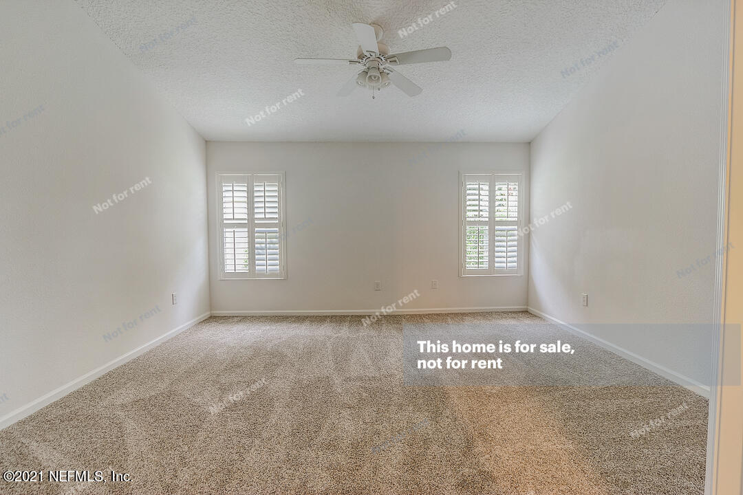608 Birchbark Trail St. Augustine, FL 32092 - Photo 20 of 35 an empty room with windows and fan