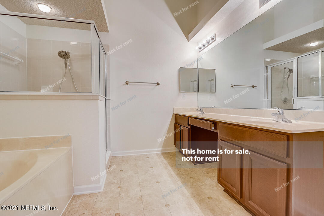 608 Birchbark Trail St. Augustine, FL 32092 - Photo 22 of 35 a bathroom with a sink and a mirror