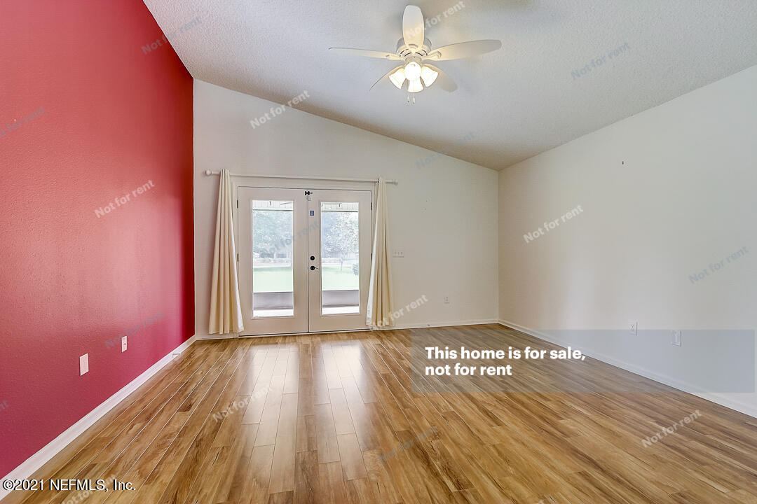 608 Birchbark Trail St. Augustine, FL 32092 - Photo 24 of 35 a view of empty room with wooden floor and fan