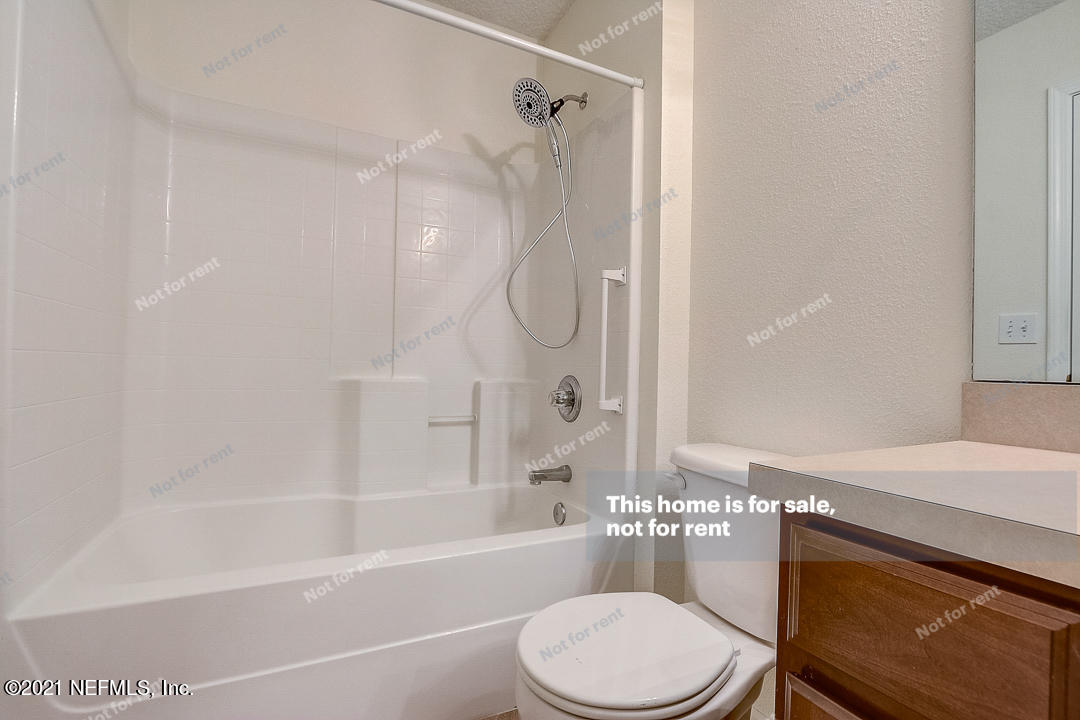 608 Birchbark Trail St. Augustine, FL 32092 - Photo 26 of 35 a bathroom with a sink a toilet and a bathtub