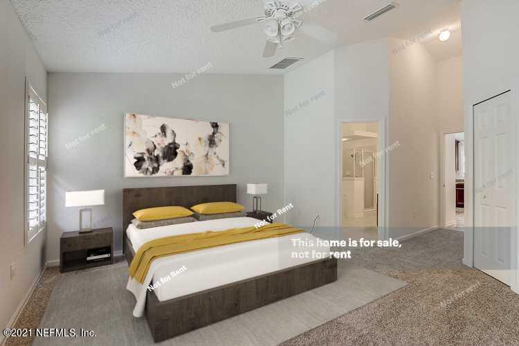 608 Birchbark Trail St. Augustine, FL 32092 - Photo 3 of 35 a bedroom with a bed and a painting on the wall