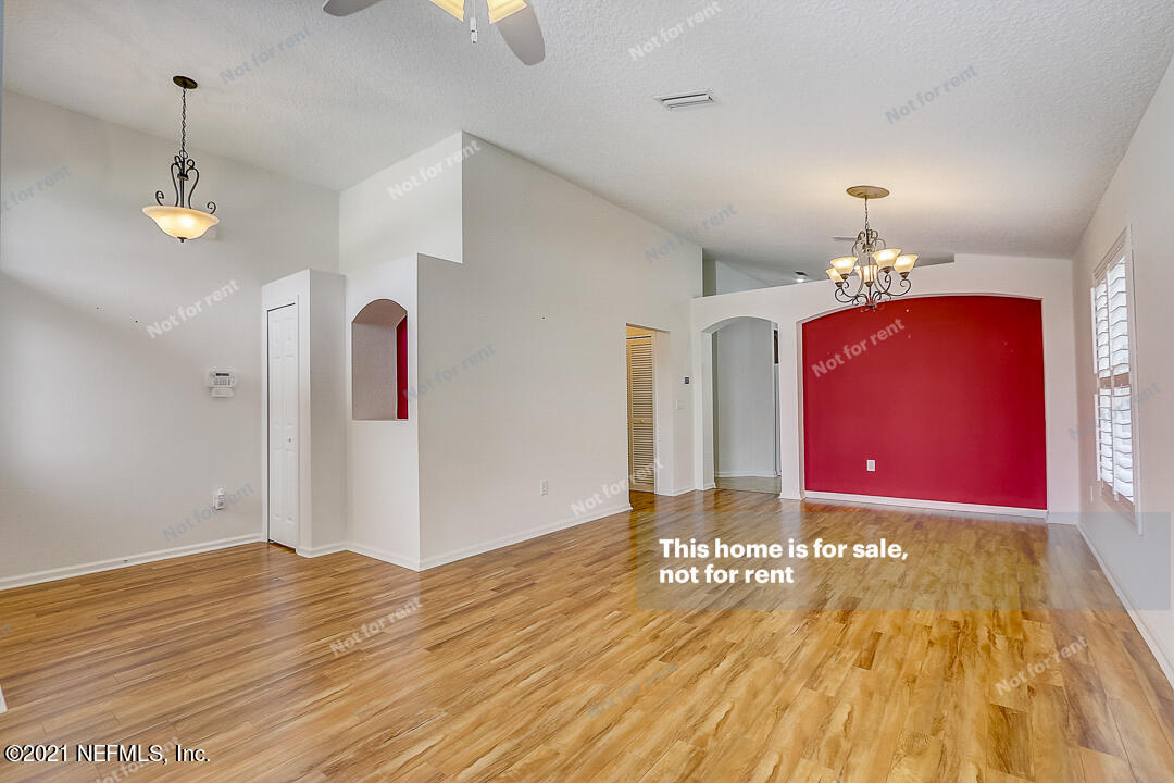 608 Birchbark Trail St. Augustine, FL 32092 - Photo 5 of 35 a view of a room with chandelier and wooden floor