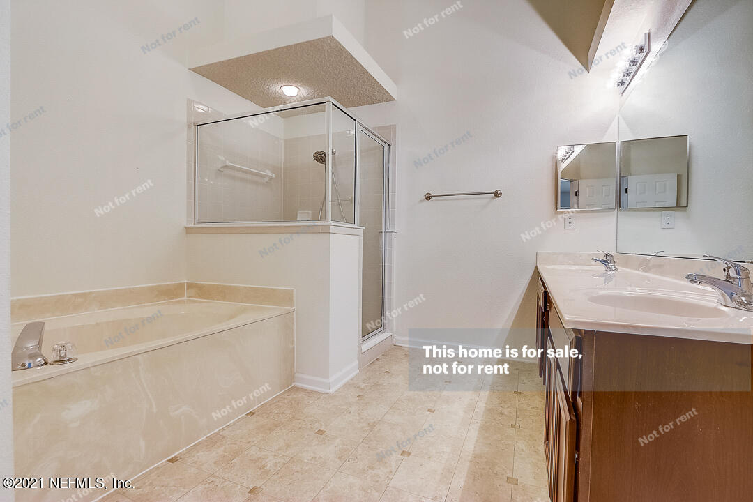 608 Birchbark Trail St. Augustine, FL 32092 - Photo 8 of 35 a bathroom with a bathtub and a sink