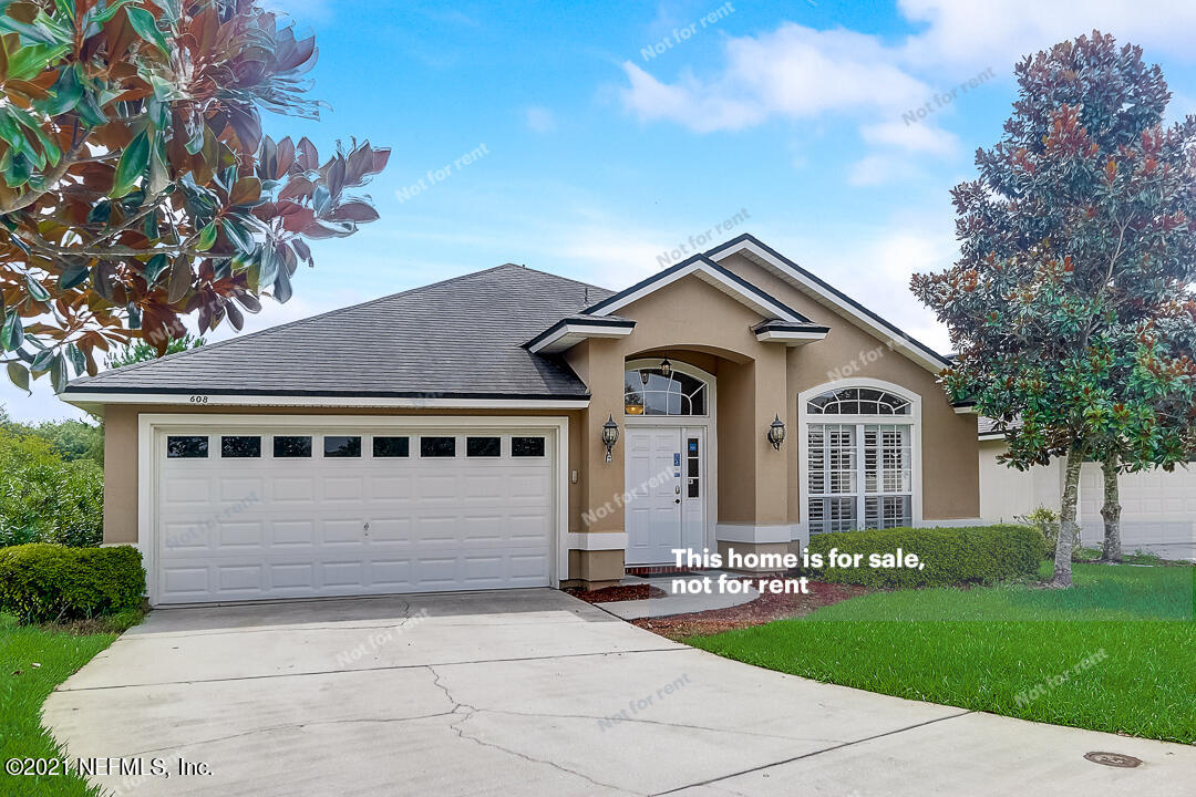 608 Birchbark Trail St. Augustine, FL 32092 - Photo 10 of 35 a front view of a house with a yard