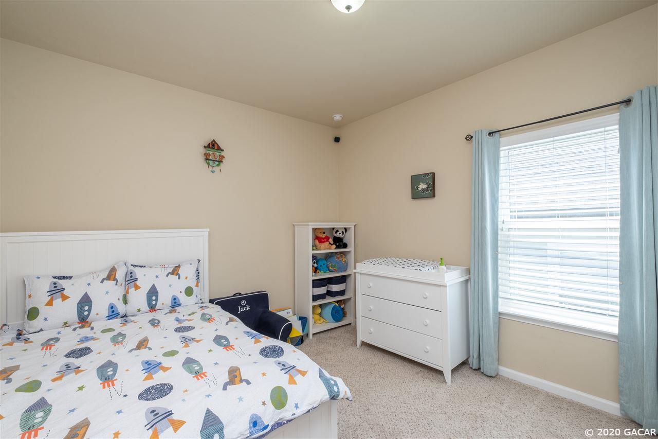 9876 Northwest 17th Road Gainesville, FL 32606 - Photo 15 of 24 Middle Bedroom