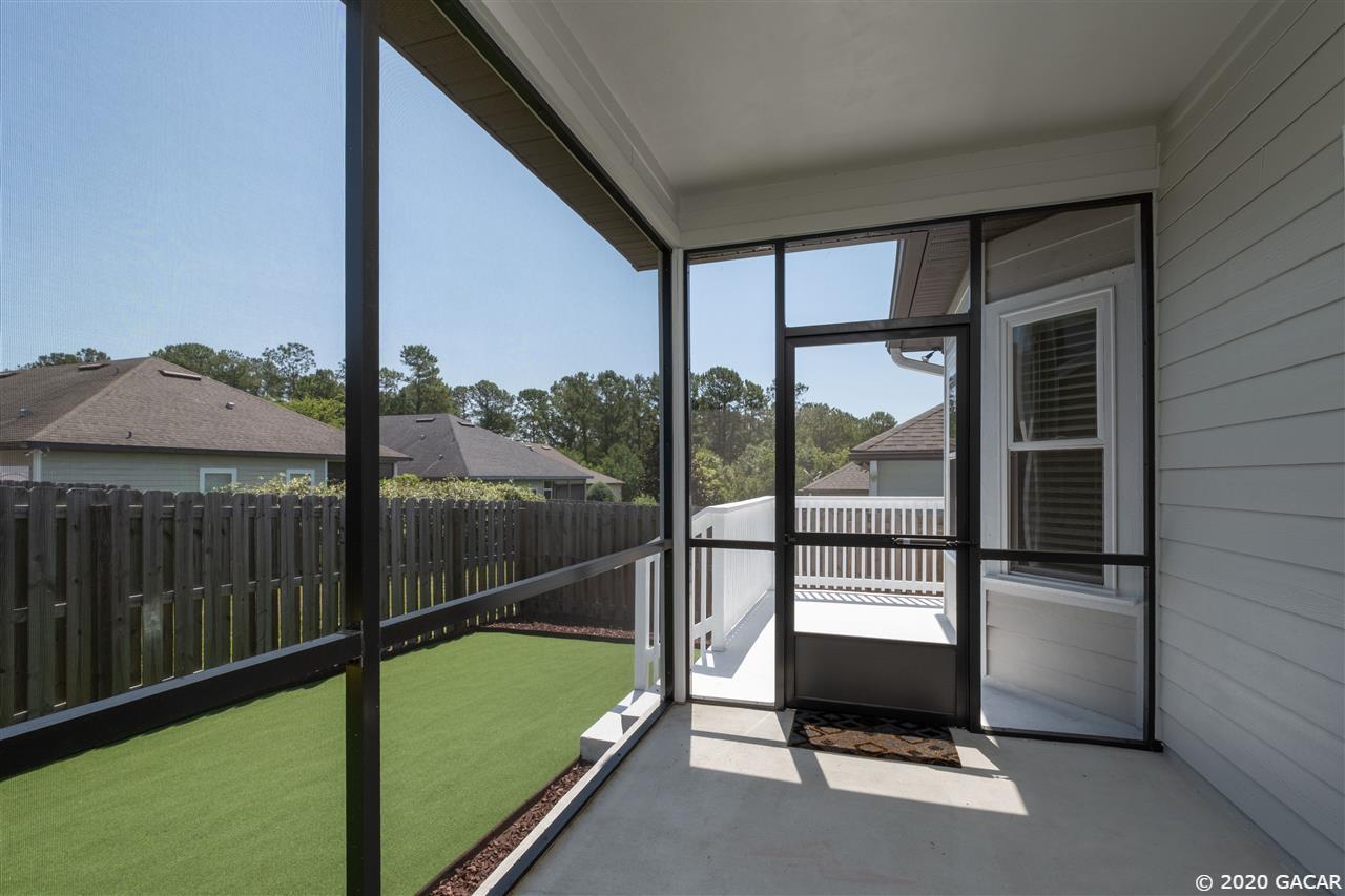 9876 Northwest 17th Road Gainesville, FL 32606 - Photo 18 of 24 Rear Screened Lanai