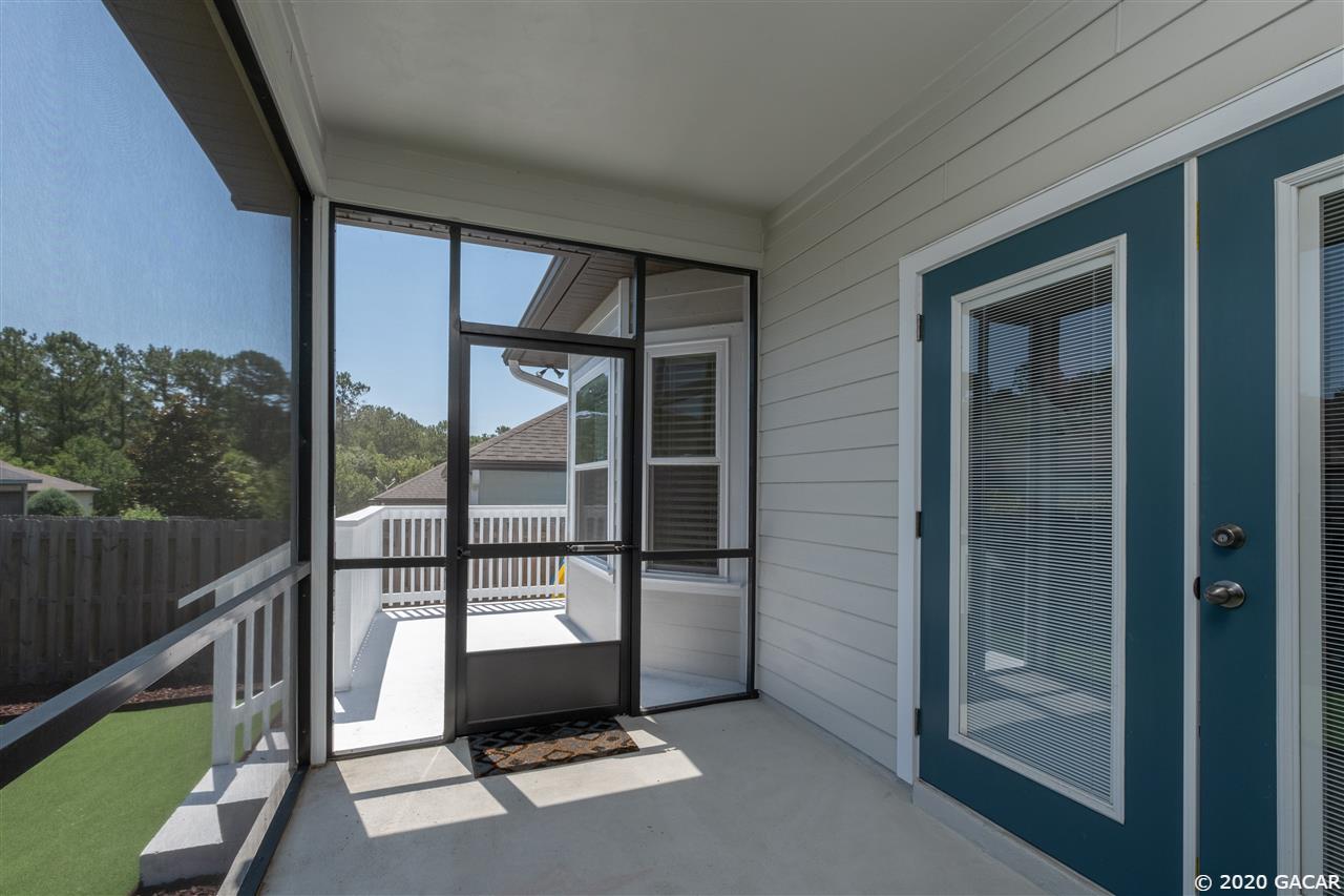 9876 Northwest 17th Road Gainesville, FL 32606 - Photo 19 of 24 Screened Lanai