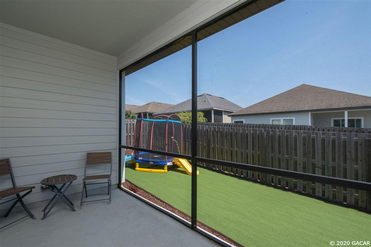 9876 Northwest 17th Road Gainesville, FL 32606 - Photo 20 of 24 Lanai & Backyard