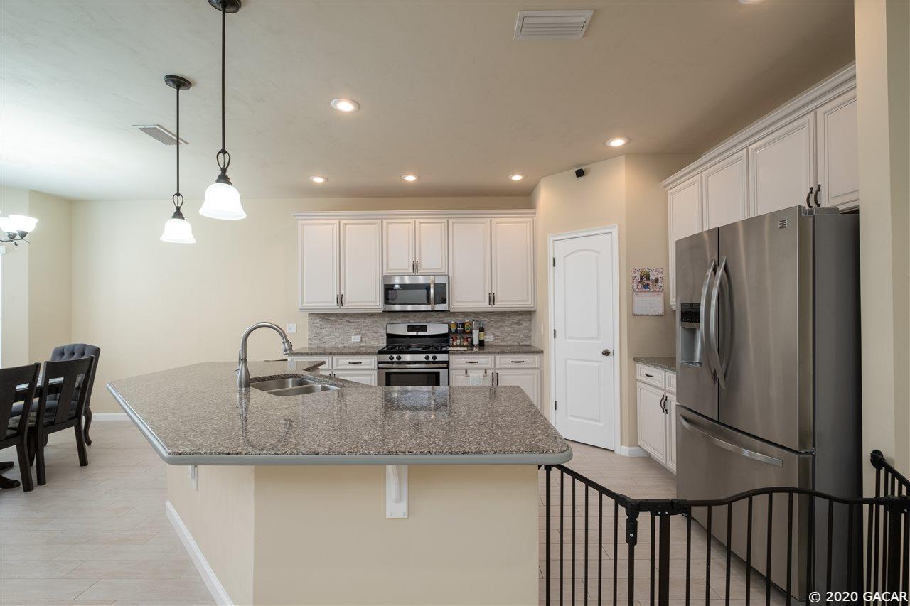 9876 Northwest 17th Road Gainesville, FL 32606 - Photo 5 of 24 Kitchen with Pantry