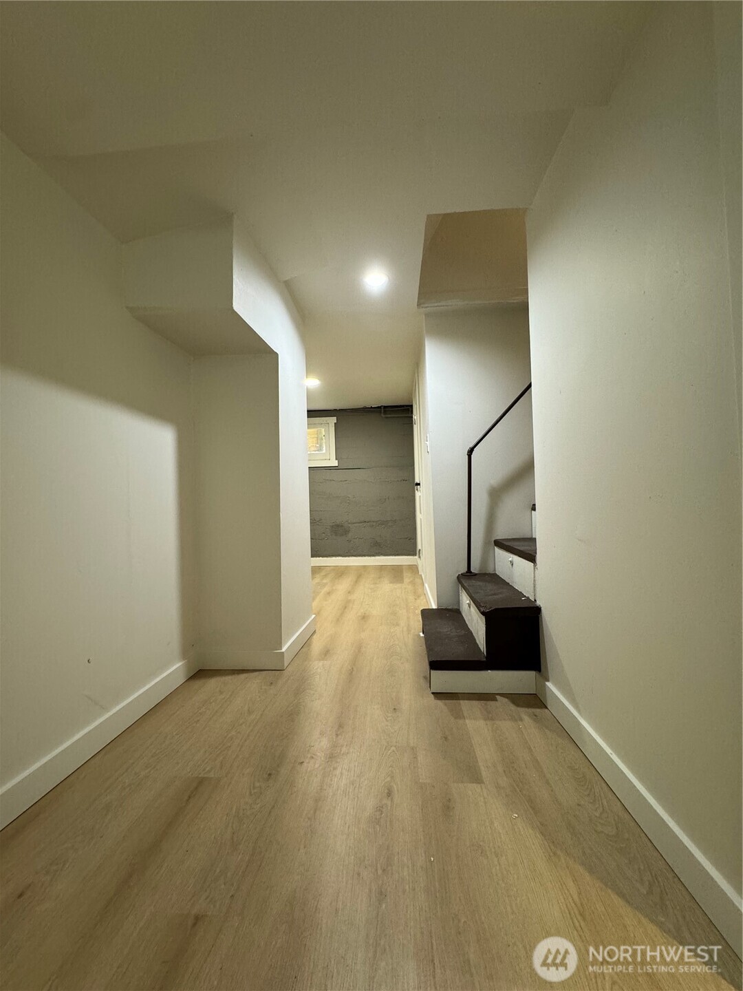 811 Northeast 66th Street Seattle, WA 98115 - Photo 18 of 36 a view of an empty room and wooden floor