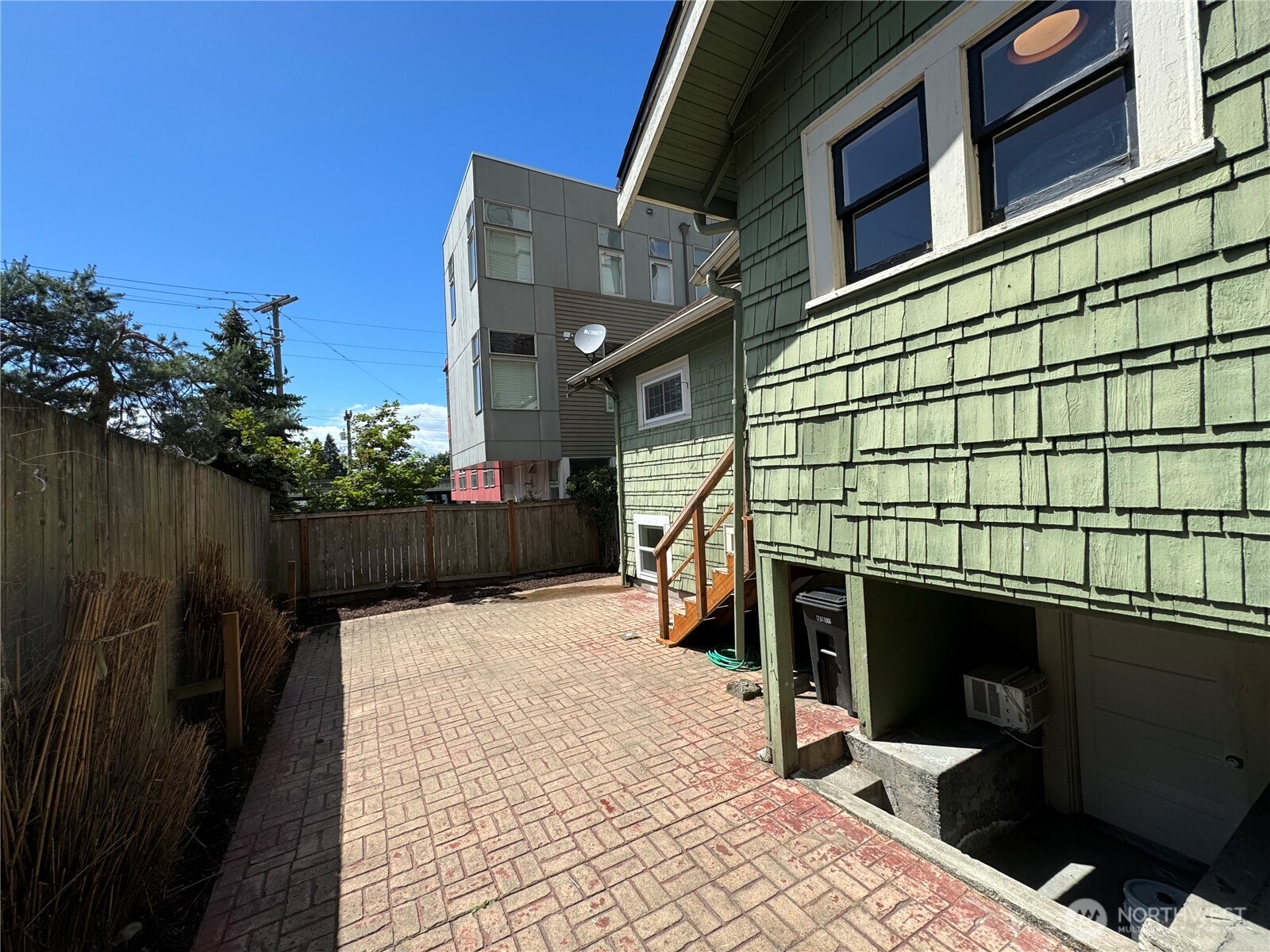 811 Northeast 66th Street Seattle, WA 98115 - Photo 27 of 36 a view of a house with a backyard