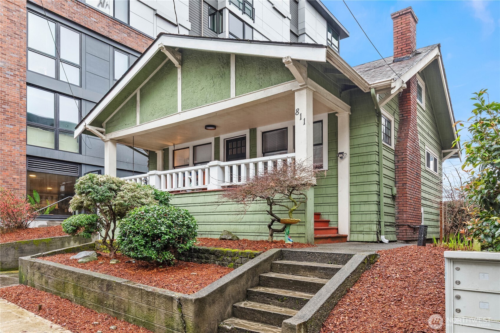 811 Northeast 66th Street Seattle, WA 98115 - Photo 4 of 36 a front view of a house with garden