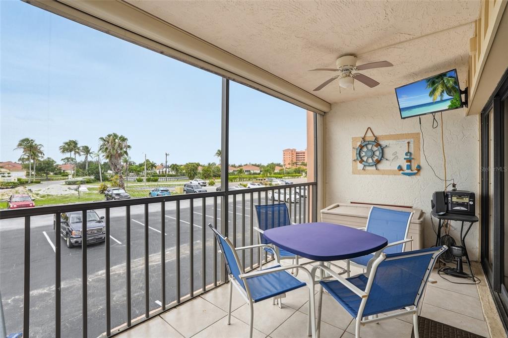 3170 Matecumbe Key Road, Unit 127 Punta Gorda, FL 33955 - Photo 16 of 22 a view of a dining room with furniture window and wooden floor
