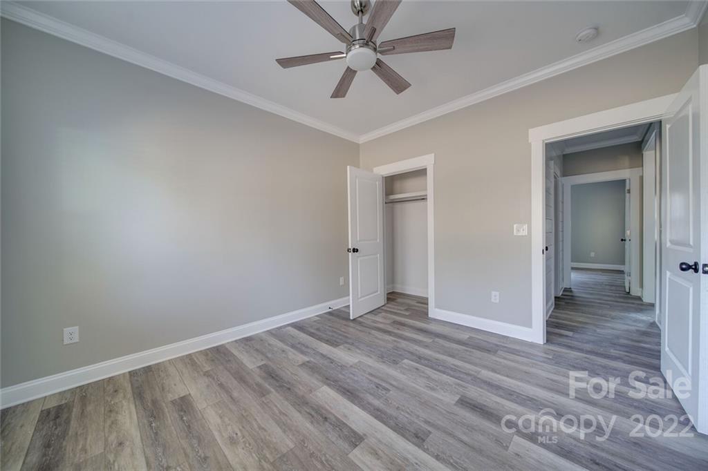 578 Crescent Road Salisbury, NC 28146 - Photo 36 of 41 wooden floor in an empty room with a fan
