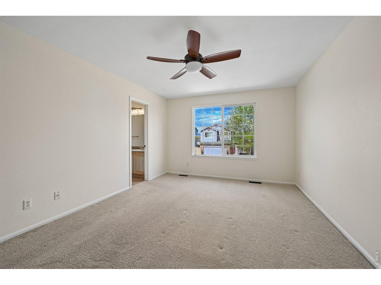 1432 Hyacinth Way Superior, CO 80027 - Photo 15 of 34 a view of an empty room with a window