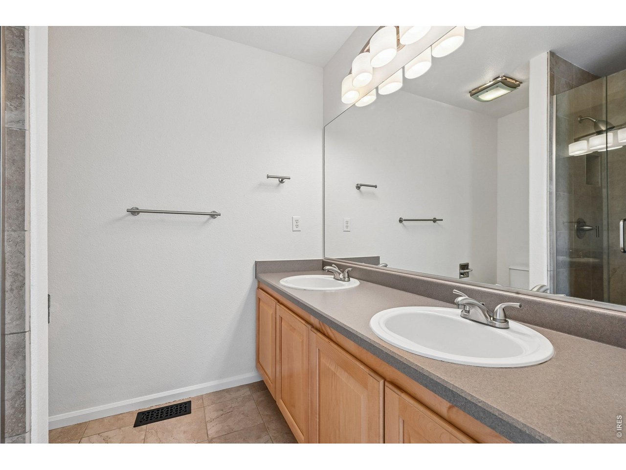 1432 Hyacinth Way Superior, CO 80027 - Photo 17 of 34 a bathroom with a sink vanity granite and a mirror