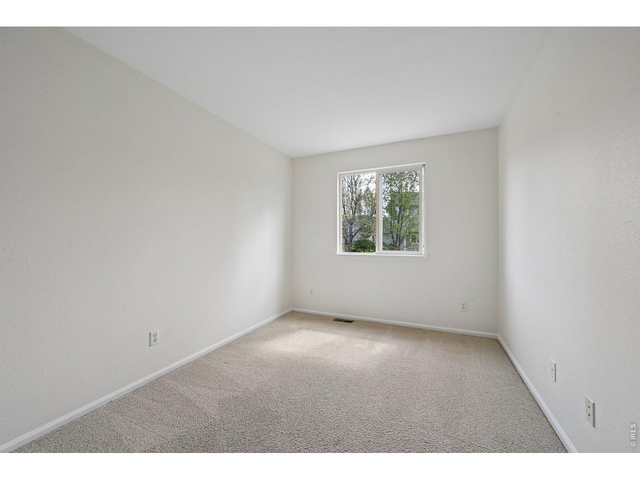 1432 Hyacinth Way Superior, CO 80027 - Photo 21 of 34 an empty room with windows