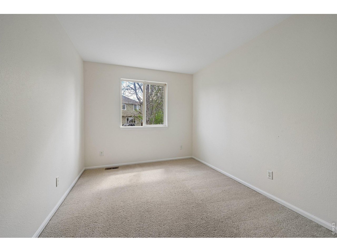 1432 Hyacinth Way Superior, CO 80027 - Photo 23 of 34 an empty room with windows
