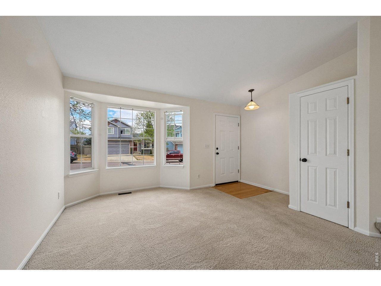 1432 Hyacinth Way Superior, CO 80027 - Photo 4 of 34 a view of an empty room with a window