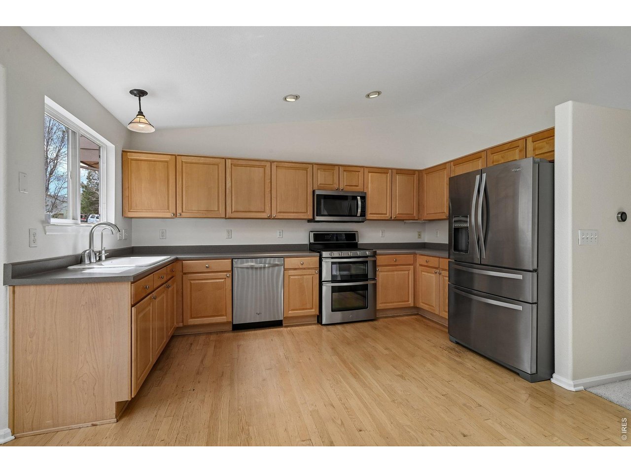 1432 Hyacinth Way Superior, CO 80027 - Photo 8 of 34 a kitchen with a refrigerator and a sink