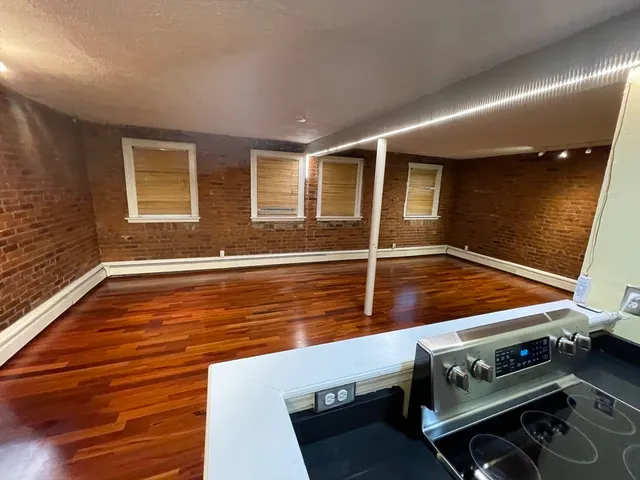 a view of kitchen with wooden floor
