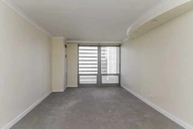 a view of an empty room with a window