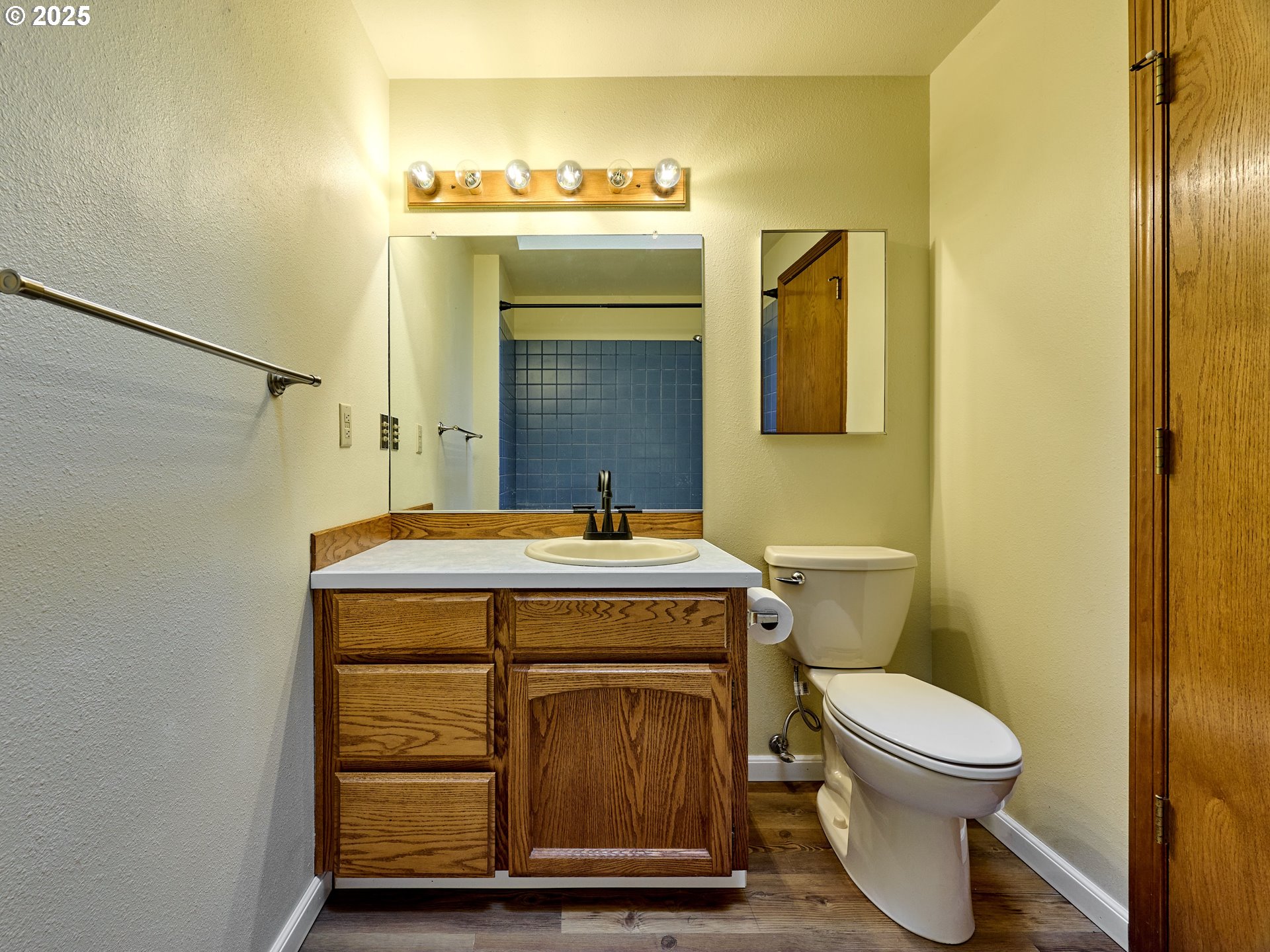 2135 Country Club Terrace Woodburn, OR 97071 - Photo 17 of 36 a bathroom with a granite countertop toilet and a sink