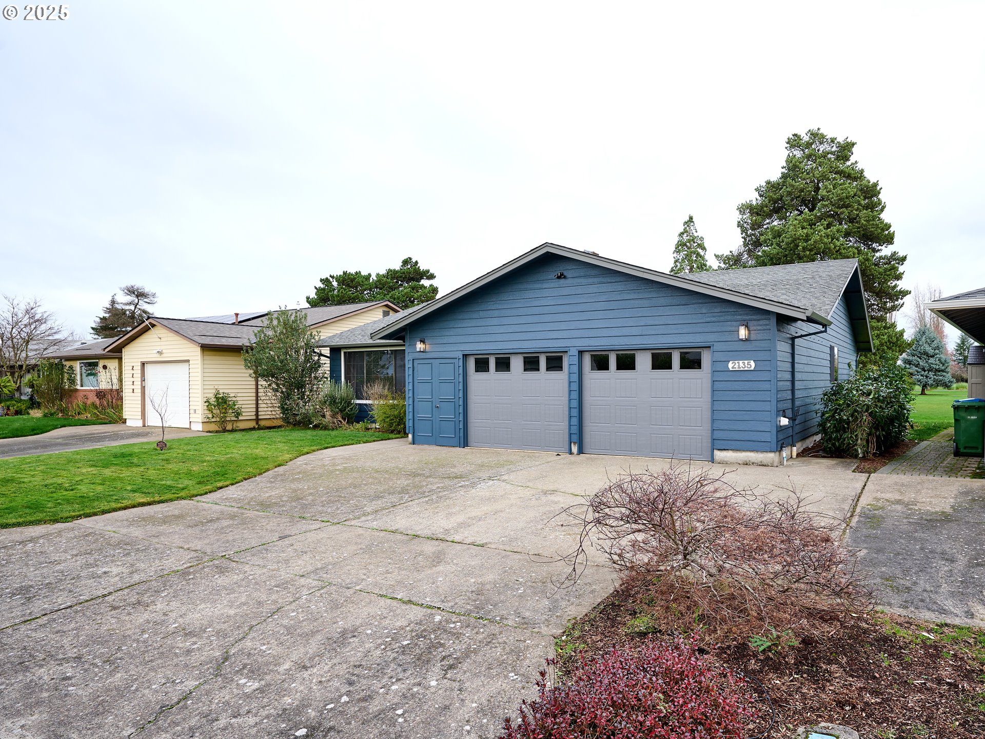 2135 Country Club Terrace Woodburn, OR 97071 - Photo 23 of 36 a view of house with a yard and large tree