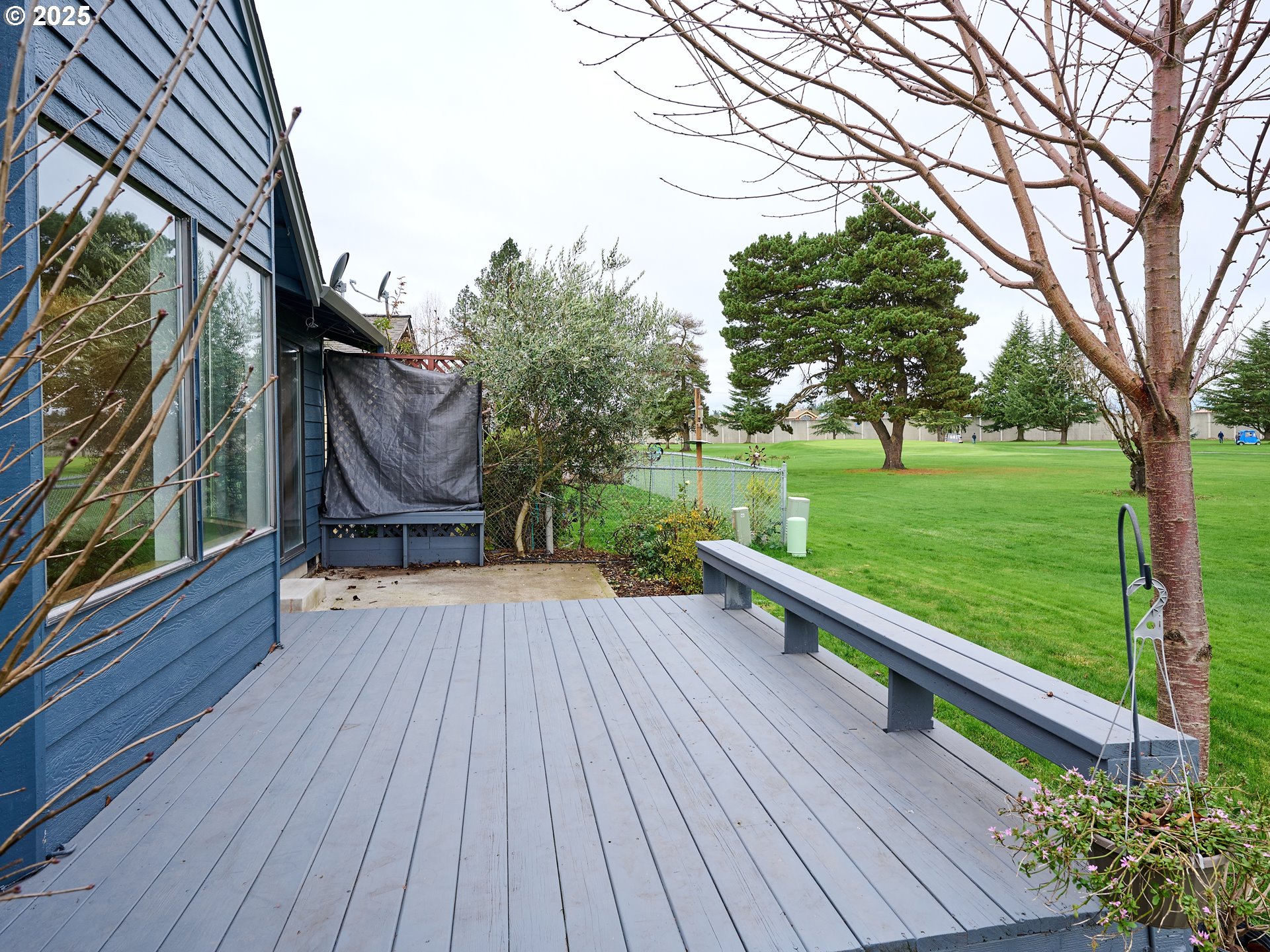 2135 Country Club Terrace Woodburn, OR 97071 - Photo 26 of 36 a view of backyard with deck and garden