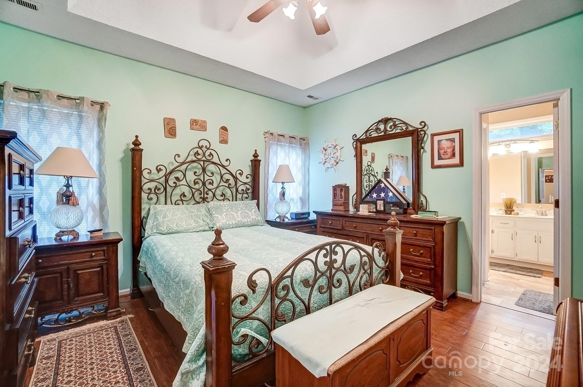 3063 River Ridge Drive Gastonia, NC 28056 - Photo 17 of 42 a bedroom with a bed and wooden floor