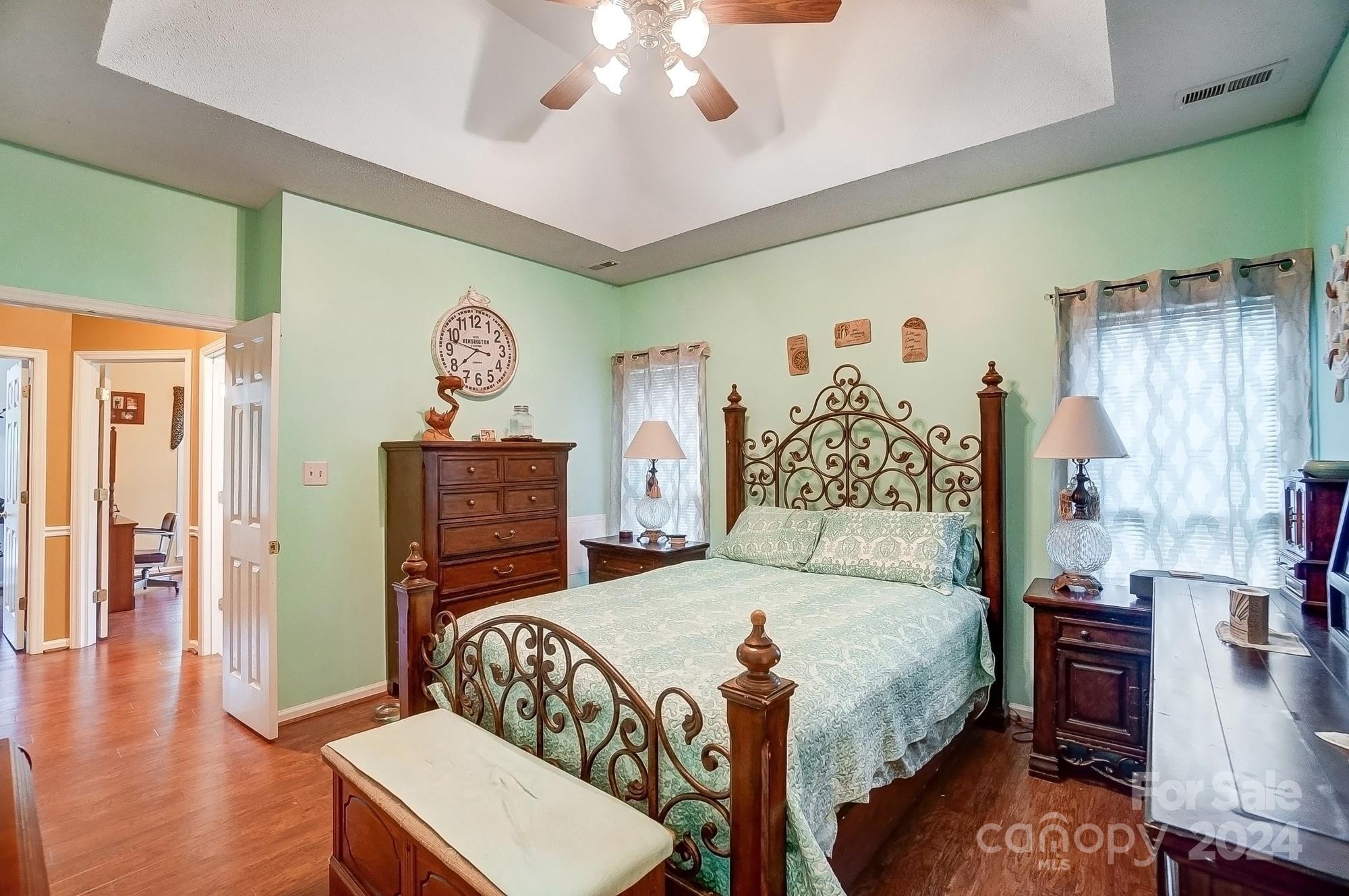 3063 River Ridge Drive Gastonia, NC 28056 - Photo 18 of 42 a bedroom with a bed and a chandelier