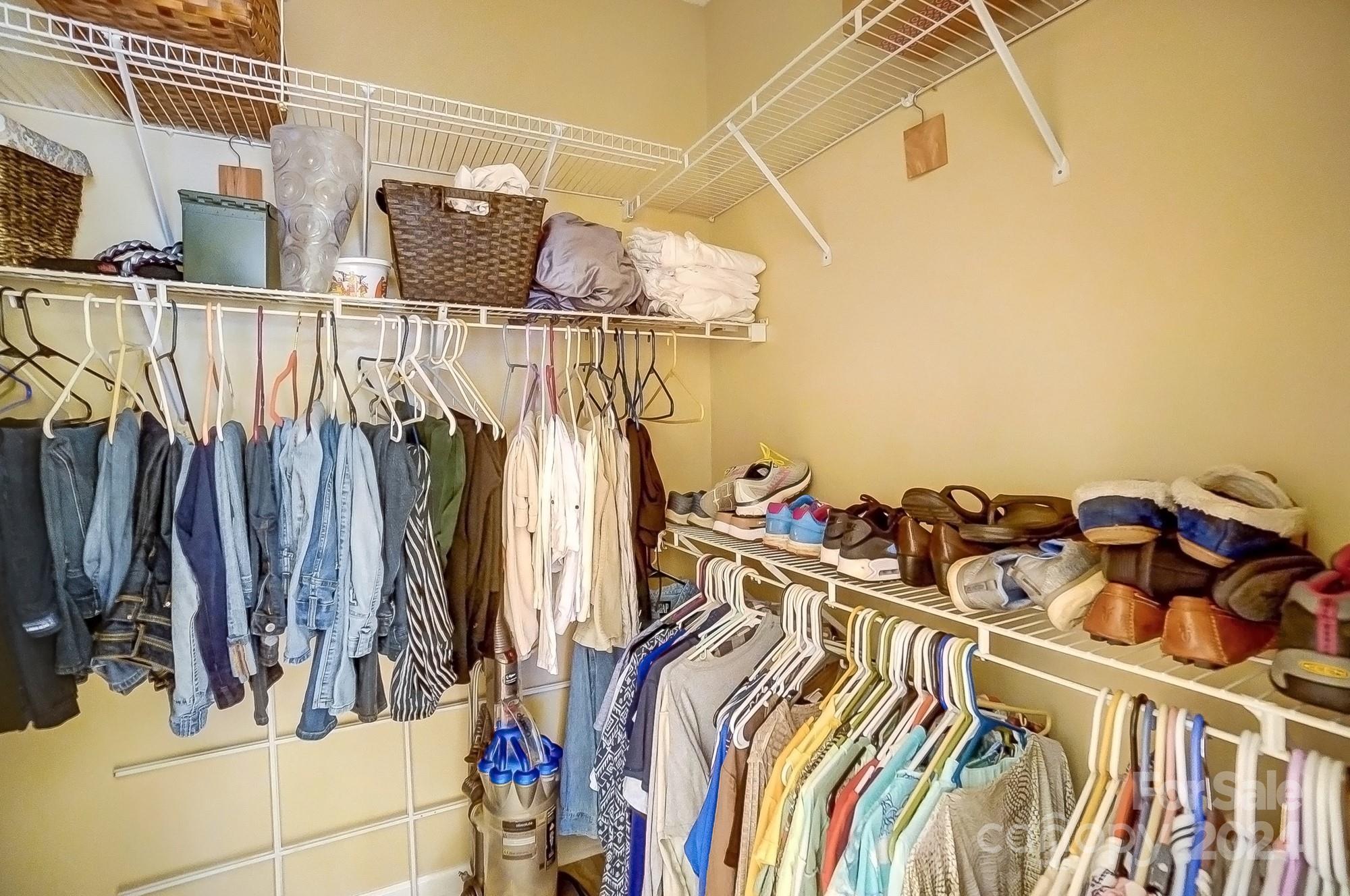 3063 River Ridge Drive Gastonia, NC 28056 - Photo 23 of 42 a view of walk in closet with clothes and shoes