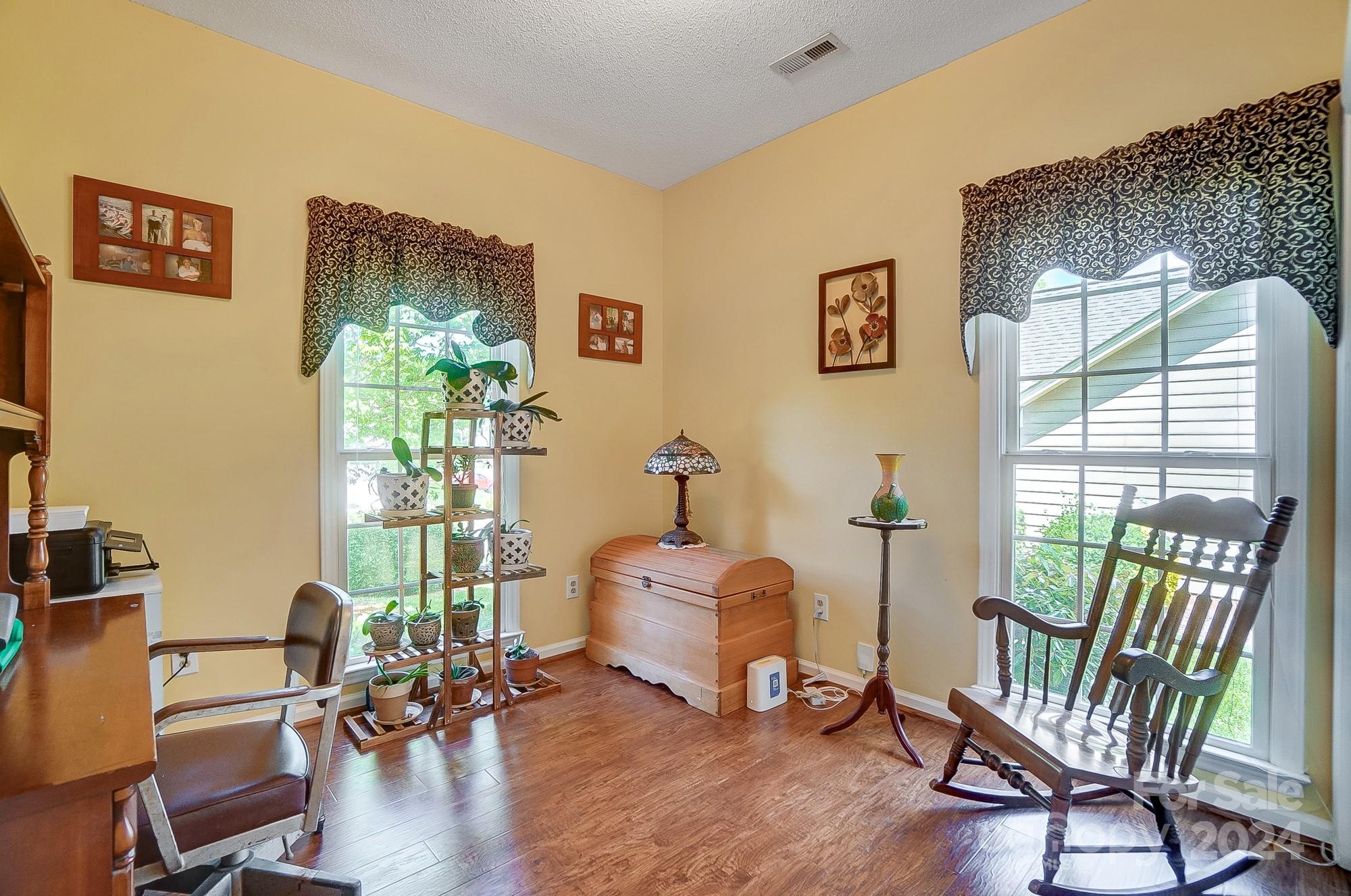 3063 River Ridge Drive Gastonia, NC 28056 - Photo 24 of 42 a living room with furniture and a window
