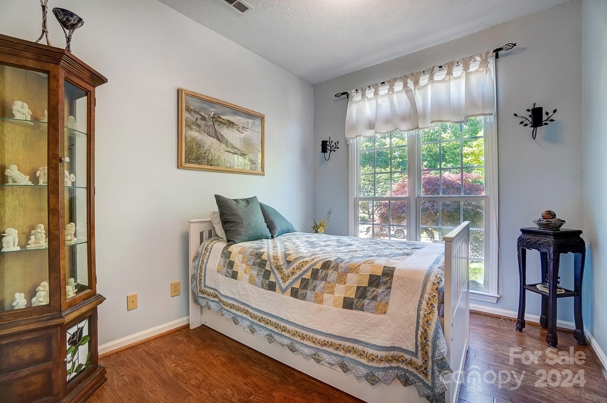 3063 River Ridge Drive Gastonia, NC 28056 - Photo 28 of 42 a bed sitting in a bedroom next to a window