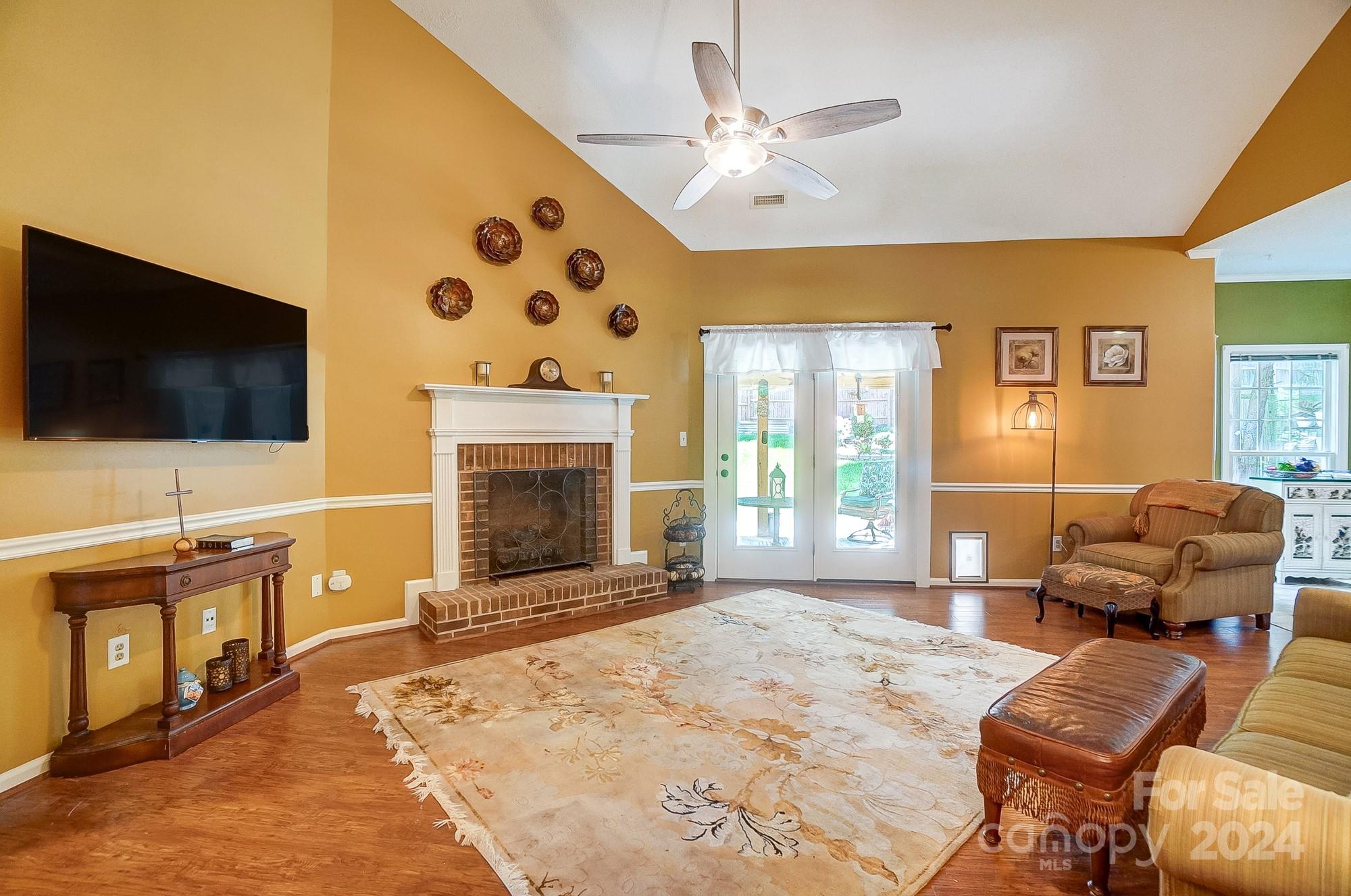 3063 River Ridge Drive Gastonia, NC 28056 - Photo 7 of 42 a living room with furniture and a flat screen tv